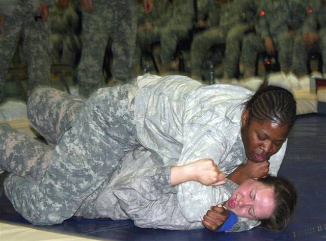 Female Soldier pushes herself and others