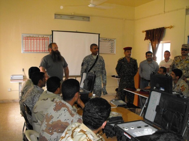 TAJI, Iraq - Brig. Gen. Owen Monconduit, 225th Engineer Brigade commander, speaks to a class of Iraqi Soldiers April 10 who are taking computer courses at the Taji engineer school. The Soldiers are expected to use their training to help rebuild the i...