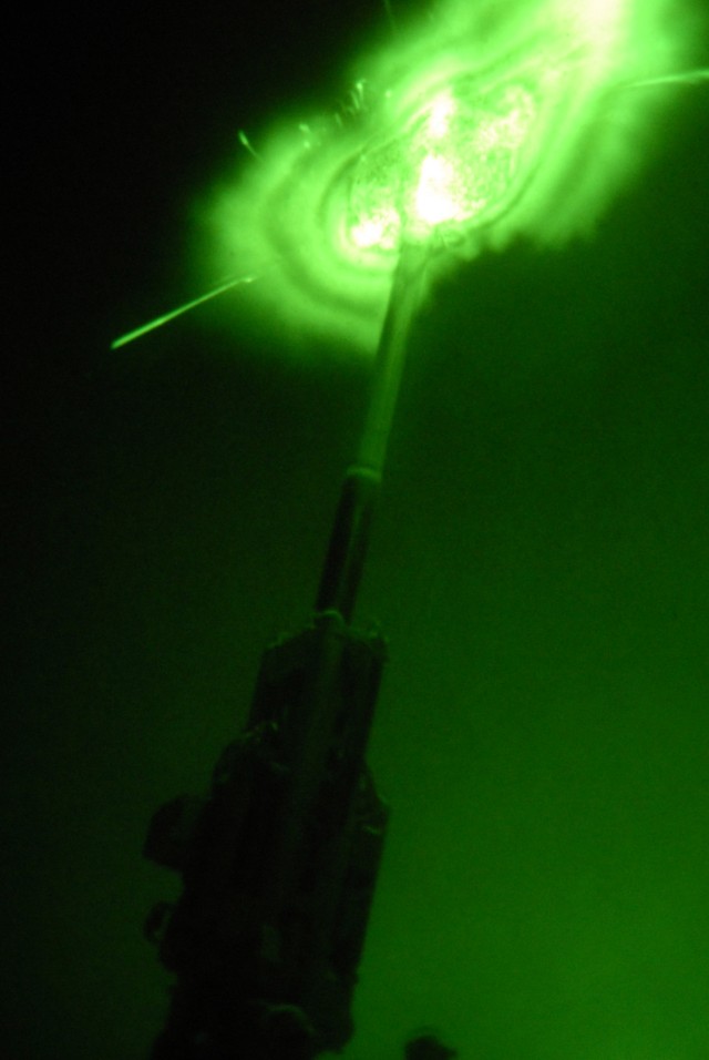 BAGHDAD - Soldiers from Bravo Battery, 1st Battalion "Arrowhead," 109th Field Artillery Regiment, 56th Stryker Brigade Combat Team, fire a 155mm illumination rounds from the M777A2 Howitzer gun at JSS Istaqlal here April 11. "Patrols are out there...