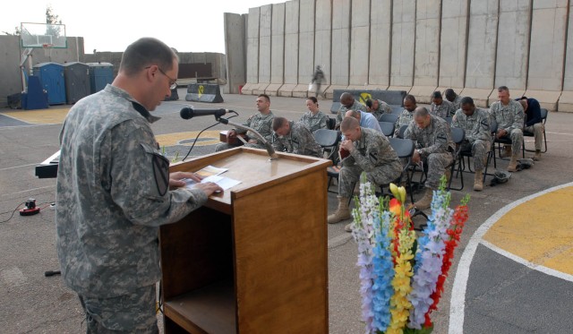 BAGHDAD- Fort Worth, Texas native Capt. Jay Hudson, 1st Battalion, 5th Cavalry Regiment, attached to the 1st "Ironhorse" Brigade Combat Team, 1st Cavalry Division leads the congregation in a prayer during the Easter Sunday Service held on Joint Secur...