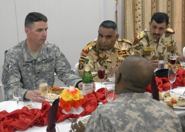 BAGHDAD - Dearborn, Mich. native Col. Joseph Martin, commander, 2nd Heavy Brigade Combat Team "Dagger," 1st Infantry Division, Multi National Division - Baghdad, meets with leaders of the 24th Brigade, 6th Iraqi Army Division for dinner at the Dagger...