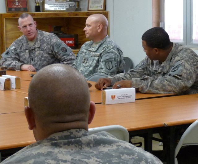 CAMP LIBERTY - 46th Engineer Combat Battalion (Heavy) Soldiers listen intently as Command Sgt. Maj. Frank Grippe (seated far left), Multi-National Corps Iraq, native of Frankfort, N.Y., gives his assessment of their convoy briefing, April 9 at Camp L...
