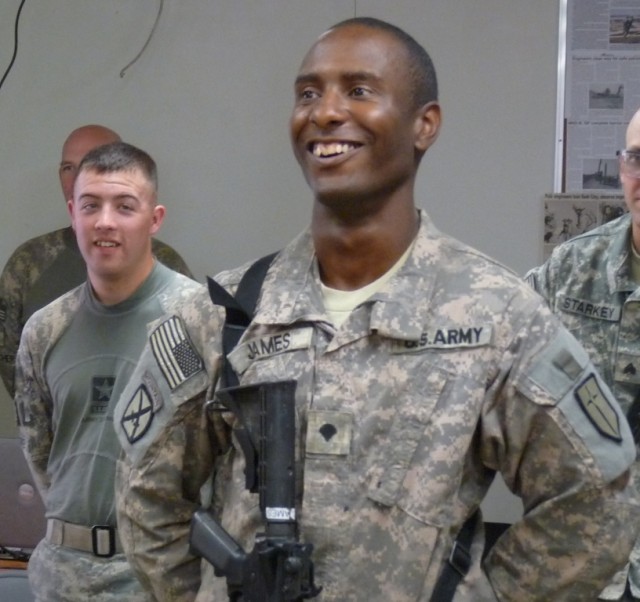 BAGHDAD - Brooklyn, N.Y. native, Spc. Kenneth James, driver, personal security detachment, 46th Engineer Combat Battalion (Heavy), 225th Engineer Brigade, smiles as he finds the Army is a very small world, April 9 on Camp Liberty, Iraq.  During a pre...
