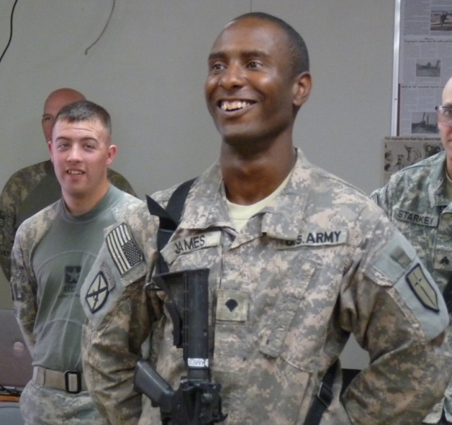 BAGHDAD - Brooklyn, N.Y. native, Spc. Kenneth James, driver, personal security detachment, 46th Engineer Combat Battalion (Heavy), 225th Engineer Brigade, smiles as he finds the Army is a very small world, April 9 on Camp Liberty, Iraq.  During a...
