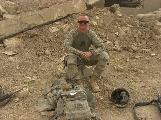 BAGHDAD- Bronx, N.Y. native Maj. Michael Clancy, brigade engineer, 2nd Brigade Combat Team, 1st Armored Division, Multi-National Division - Baghdad, takes a break at Patrol Base McHale during an operation in August 2008. Clancy is on his third deploy...