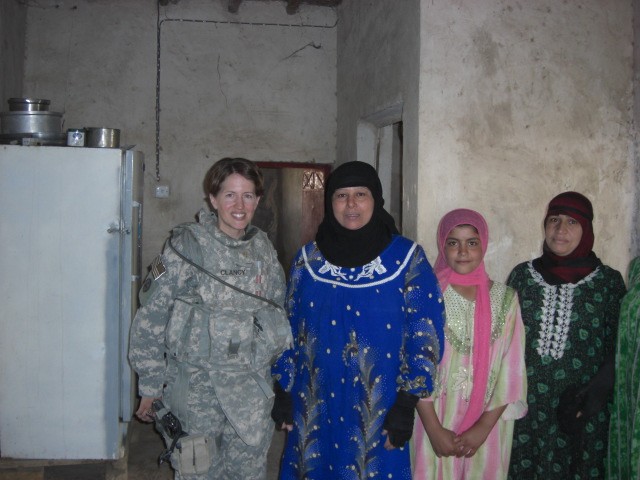 BAGHDAD- Lt. Col. Hailey Clancy, of Mesa, Ariz., 2nd Brigade Combat Team, 1st Armored Division, Multi-National Division - Baghdad, meets with Iraqi women in Jisr Diyala, Iraq. Clancy and her husband, Maj. Mike Clancy, of the Bronx, N.Y., are one of n...