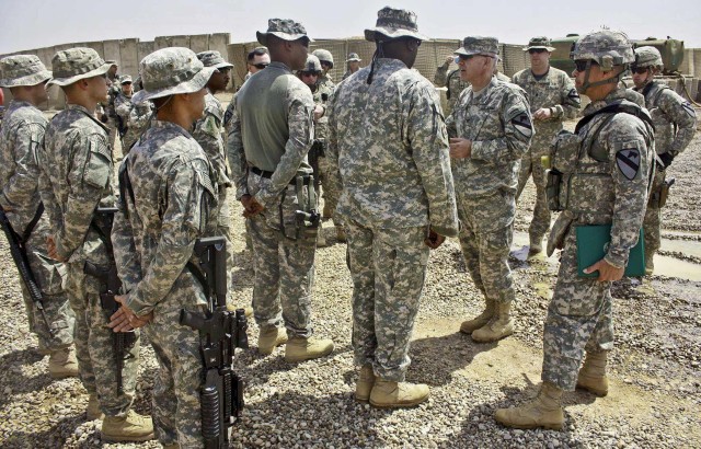 Col. Philip Battaglia and Command Sgt. Maj. Edwin Rodriguez, the commander and senior enlisted Soldier of the 4th Brigade Combat Team, 1st Cavalry Division, congratulate three platoon sergeants with news of their pending promotions to sergeant...