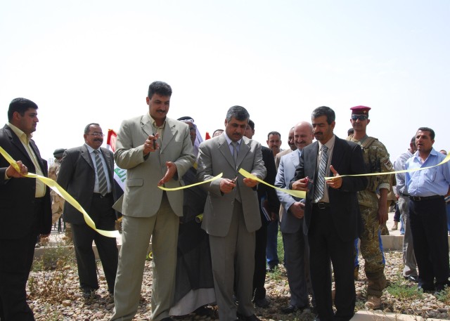 Iraqi Leaders from the Ministry of Electricity cut the ceremonial ribbon, April 8, to signify the opening of a new 33-volt feeder line providing power to the citizens of Agurquf in the Abu Ghraib district. The joint project will provide more...