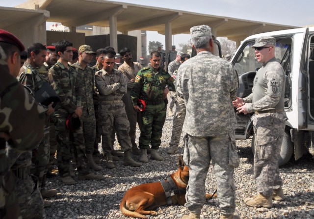 Staff Sgt. Michael Hile, a military working dog handler with the 527th Military Police Company, 709th Military Police Battalion, 18th Military Police Brigade, and a native of Prineville, Ore., explains the importance of the military working dog to th...