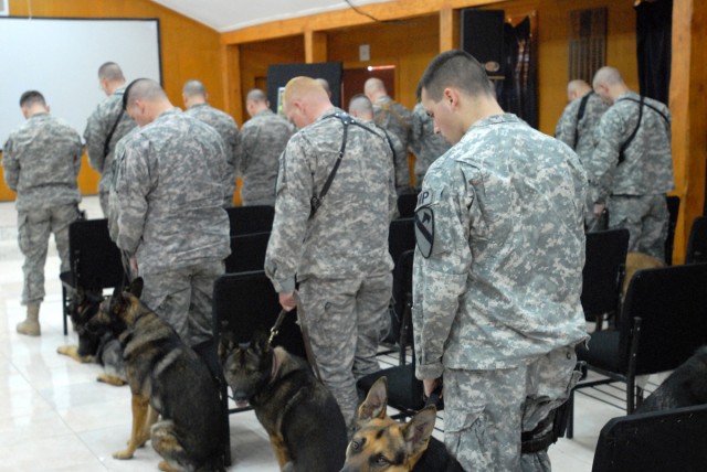 Soldiers and their military working dog partners take time to pray in honor of Kevin, a military dog who succumbed to cancer.  "It was a good memorial, they don't happen often for the dogs," said Sgt. Matt McCummins, a military dog handler, attached ...
