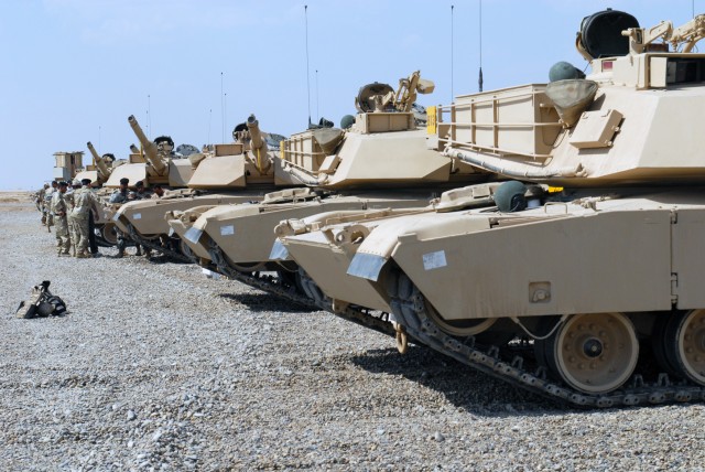 BAGHDAD - A line of M1A1 Abrams tanks sit in the Iraqi sun as Soldiers of the 9th Iraqi Army Division receive instruction on the basics of tank operation April 11 at Forward Operating Base Hammer. The Iraqi government has purchased 140 Abrams...