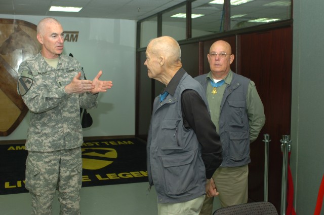 BAGHDAD - Aurora, Ill. native, Maj. Gen. Daniel P. Bolger, commanding general, 1st Cavalry Division and Multi-National Division-Baghdad,  expresses his appreciation to Medal of Honor recipients, retired Col. Robert L. Howard (center) and retired Comm...