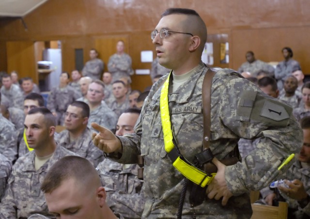 Staff. Sgt. Andres Redondo, a native of Overland Park, Kan., who serves with the 5th Squadron, 4th Cavalry Regiment, 2nd Heavy Brigade Combat Team, 1st Infantry Division, Multi-National Division - Baghdad, asks a question directed to Col. (retired) R...