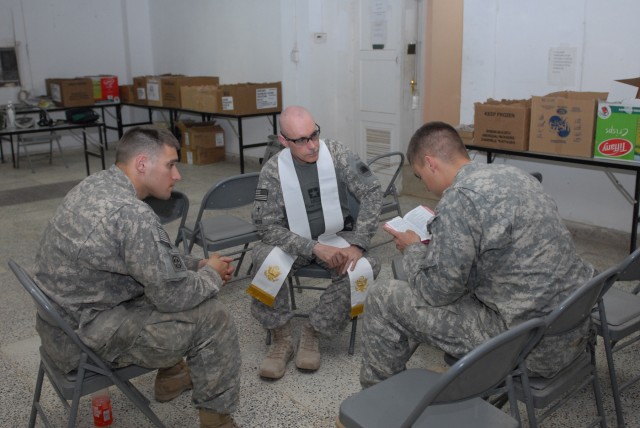 BAGHDAD - Chaplain (Capt) Timothy Meier, MND-B deputy operations chaplain, engages two Soldiers of the Company B, 2nd Battalion, 505th Parachute Infantry Regiment assigned to Joint Security Station Hope on Easter Sunday. Regardless of the size of...