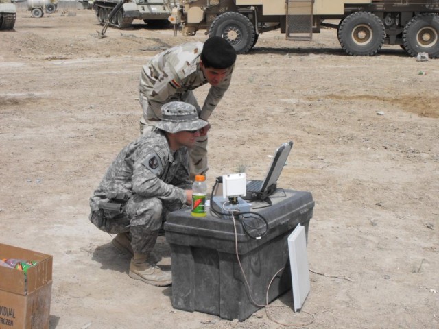 Soldiers with the 225th Engineer Brigade., Multi-National Division - Baghdad, help train 9th Iraqi Army Engineer Regiment Soldiers on the Talon robot at Al Rasheed. Talons are used to clear IEDs in Iraq. The newer models like the one pictured...