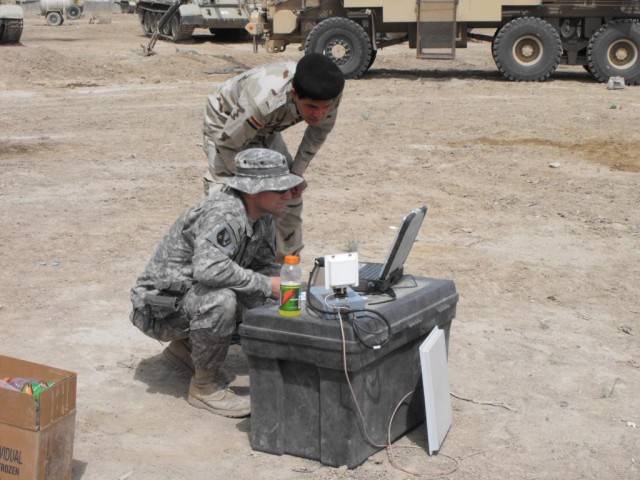 Soldiers with the 225th Engineer Brigade., Multi-National Division - Baghdad, help train 9th Iraqi Army Engineer Regiment Soldiers on the Talon robot at Al Rasheed. Talons are used to clear IEDs in Iraq. The newer models like the one pictured above c...