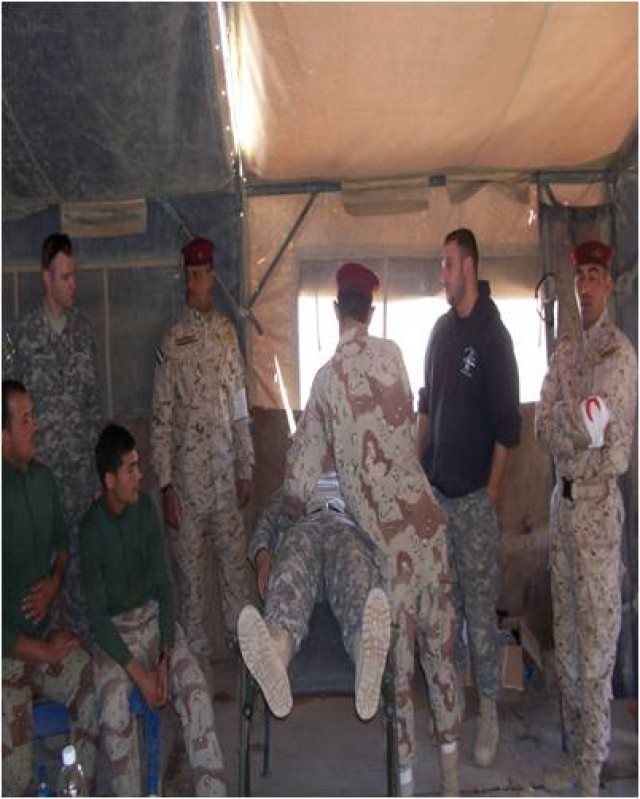 Iraqi soldiers from the 15th Iraqi Army Brigade are evaluated on assessing a patient by Soldiers from 1st Battalion, 8th Cavalry Regiment, 2nd Brigade Combat Team, 1st Cavalry Division, during a week-long medical train-the-trainer course at...
