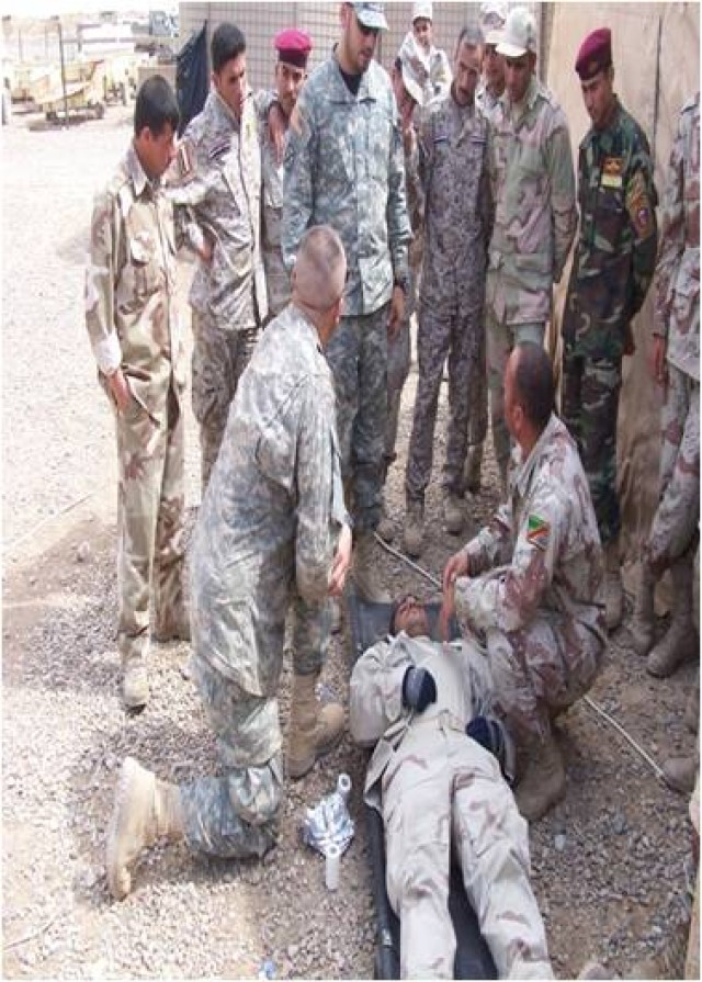 Iraqi soldiers from the 15th Iraqi Army Brigade are evaluated on the proper procedures for identifying and caring for a chest wound by Soldiers from 1st Battalion, 8th Cavalry Regiment, 2nd Brigade Combat Team, 1st Cavalry Division, during a...
