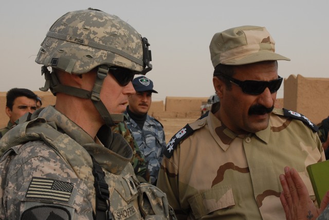 Lt. Col. Andy Shoffner, the commander of 4th Squadron, 9th U.S. Cavalry Regiment,
2nd Brigade Combat Team, 1st Cavalry Division, and Brig. Gen. Sarhad Qadir, the
police chief of the country area in Kirkuk province, discuss an operation April 7th in a...