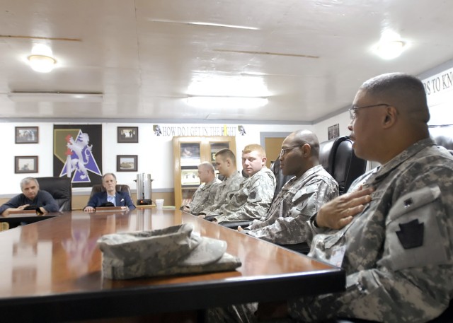BAGHDAD - Staff Sgt. Philip White (right foreground), a native of Pittsburgh, Pa., 2nd Stryker Battalion, 112th Infantry Regiment, attached to the 2nd Heavy Brigade Combat Team "Dagger," 1st Infantry Division, Multi-National Division - Baghdad speaks...