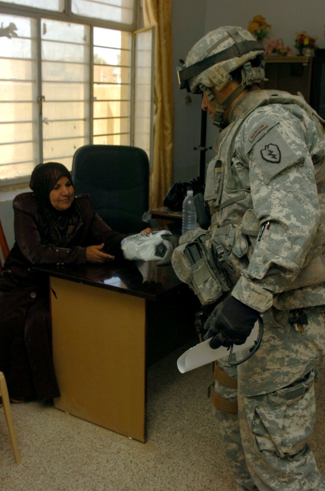 Tropic Lightning Security Detachment Donates Books to Local Tikrit Schools