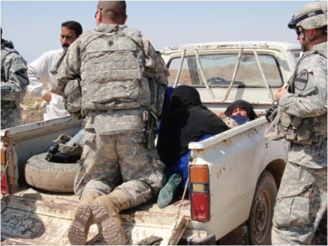 A new baby boy is delivered with the assistance of U.S. Army medics near Dalish, Iraq, April 21. Spc. Nicholas Martin and Pfc. Michael Guerrero, both medics with 4th Squadron, 9th Cavalry Regiment, 2nd Brigade Combat Team, 1st Cavalry Division,...