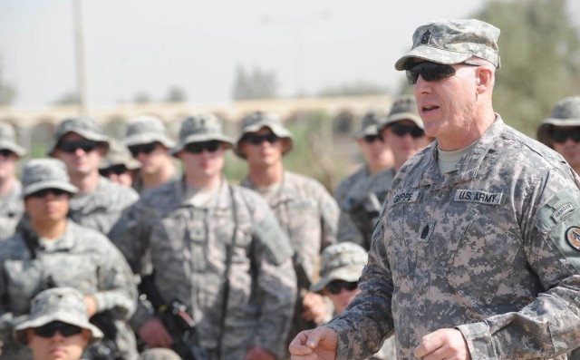BAGHDAD - Command Sgt. Maj. Frank Grippe, senior enlisted leader of Multi- National Corps - Iraq, addresses paratroopers after a reenlistment ceremony April 23 at the Cross Sabers in Baghdad. Eighty-two paratroopers assigned to the 5th Squadron, 73rd...