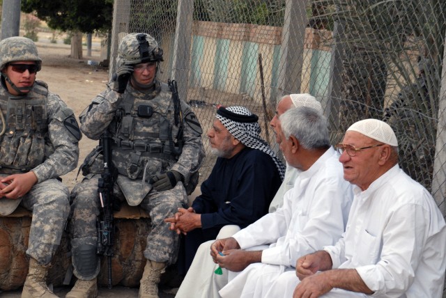 BAGHDAD -2nd Lt. Matthew Morgan, from Bossier City, La., a platoon leader with Company B, 2nd Battalion, 5th Cavalry Regiment, meets with local residents in Sadr City to inquire about the needs of the community. "I usually find someone to talk to...