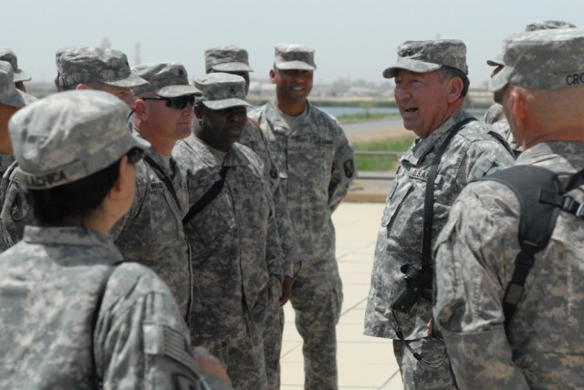 BAGHDAD - Louisiana's adjutant general, Maj. Gen. Bennett Landreneau (right), visits with Soldiers from 225th Engineer Brigade from Pineville, La., at Camp Liberty April 22. The former commander of the 225th Eng. Bde., said he was humbled to visit...
