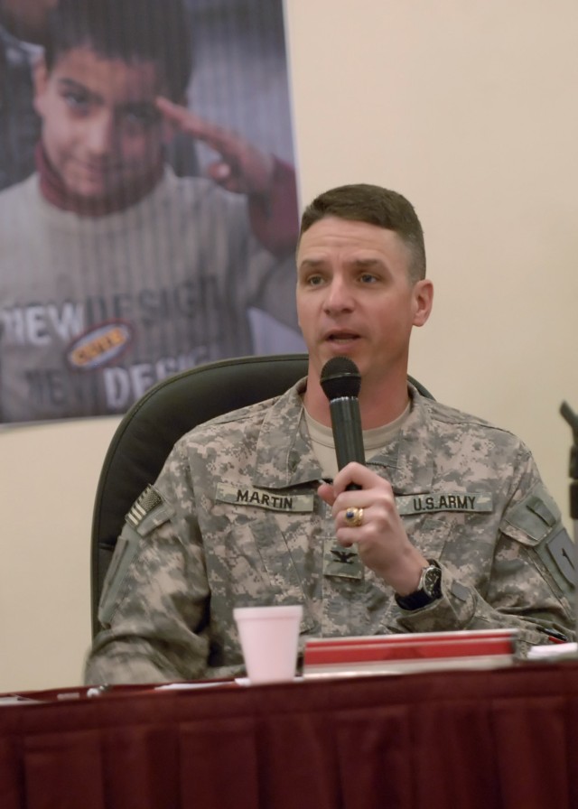 BAGHDAD - Col. Joseph Martin, a native of Dearborn, Mich., commander, 2nd Heavy Brigade Combat Team, 1st Infantry Division, Multi-National Division - Baghdad, addresses the local Baghdad media at a press-conference style discussion in the Internation...
