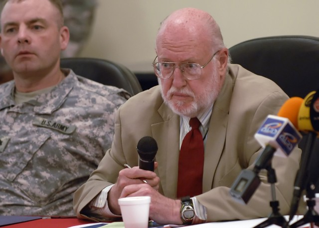 BAGHDAD - Ambassador John Bennett, leader of the embedded Provisional Reconstruction Team, alongside Lt. Col. John Vermeesch, IV, commander, 1st Combined Arms Battalion, 18th Infantry Regiment, 2nd Heavy Brigade Combat Team, 1st Infantry Division,...