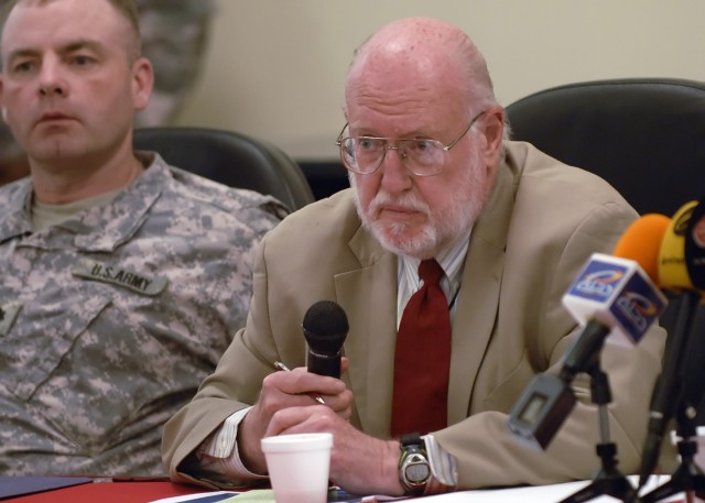 BAGHDAD - Ambassador John Bennett, leader of the embedded Provisional Reconstruction Team, alongside Lt. Col. John Vermeesch, IV, commander, 1st Combined Arms Battalion, 18th Infantry Regiment, 2nd Heavy Brigade Combat Team, 1st Infantry Division, Mu...