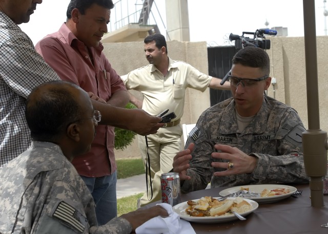 BAGHDAD - Members of the Iraqi media interview Col. Joseph Martin, a native of Dearborn, Mich., commander, 2nd Heavy Brigade Combat Team, 1st Infantry Division, Multi-National Division - Baghdad over lunch at the Freedom Rest Center April 26. Martin ...