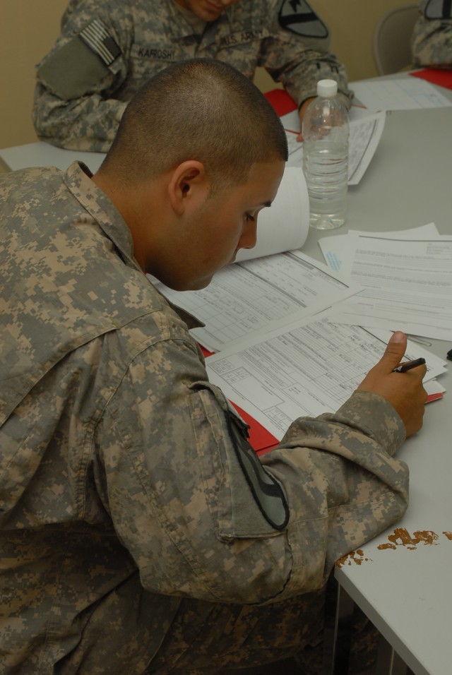 Pfc. Alberto Chapa, a Monterrey, Mexico, native and a truck driver for Compay G, 3rd Battalion, 82nd Field Artillery Regiment, 2nd Brigade Combat Team, 1st Cavalry Division, fills out citizenship paperwork during a citizenship clinic April 17 on...