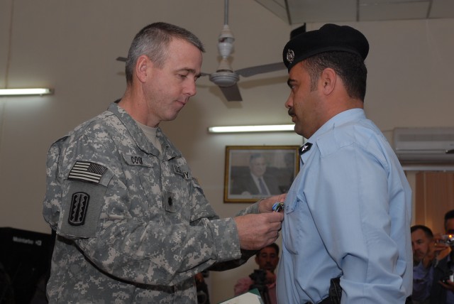 Both Iraqi police officers and 3rd Battalion, 82nd Field Artillery, 2nd Brigade Combat Team, 1st Cavalry Division, also known as the "Red Dragons," Soldiers honored 21 IPs who were given U.S. Army Achievement Medals April 8 in Kirkuk city during...