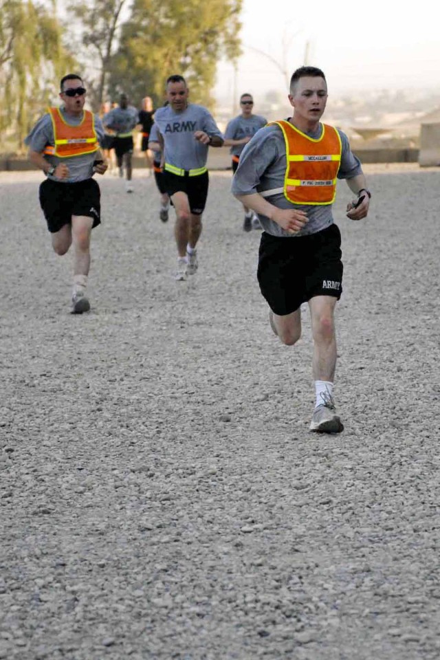 Soldiers sprint towards the finish of a 4-mile run in support of Sexual Assault Awareness Month April 24. The run was sponsored by the 3rd Heavy Brigade Combat Team, 1st Cavalry Division Equal Opportunity Team to raise local awareness of sexual...
