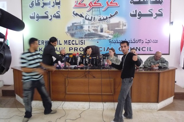 Local Iraqi media take focus on Fawzie Abdullah Awanis, the Kirkuk Deputy Director General of Education, at a conference in downtown Kirkuk city, Iraq, April 14. The conference discussed delivering 250,000 textbooks to local schools throughout...