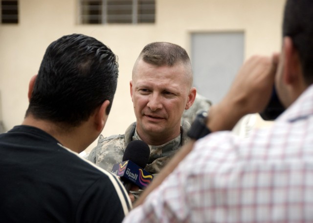 Lt. Col. Samuel Hayes, a native of New Port, Pa., commander, 2nd Stryker Battalion, 112th Infantry Regiment, operationally attached to the 2nd Heavy Brigade Combat Team, 1st Infantry Division, Multi-National Division - Baghdad, speaks with members...