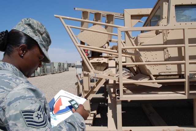 Tech. Sgt. Burrell places AMC decal