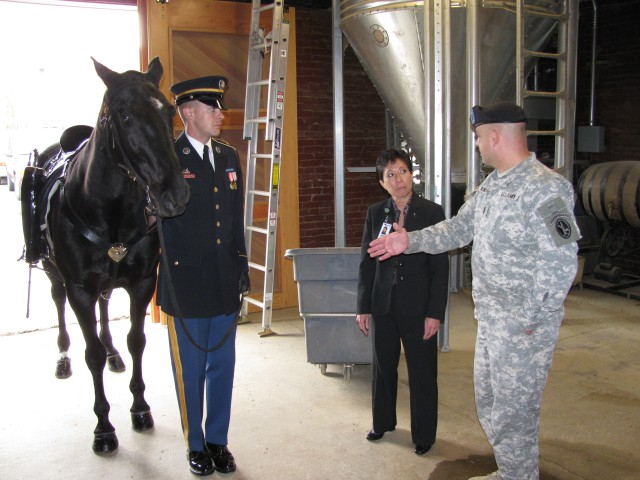CW4 Anthony Direnzo explains the mission of the caparisoned horse to Dr. Heirakuji.