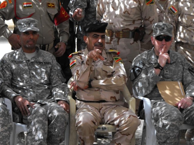 BAGHDAD - Brig. Gen. Owen Monconduit (left), commander of the 225th Engineer Brigade, and Brig. Gen. John Murray (right), Deputy Commanding General-Maneuver for Multi-National Division-Baghdad, listen as the 9th Iraqi Army Division Commander, Maj....