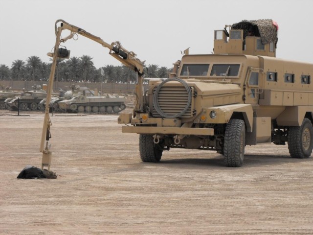 BAGHDAD - Soldiers with the 9th Iraqi Army Engineer Regiment conduct a demonstration on clearing routes of improvised explosive devices to culminate training they received from instructors with the 515th Engineer Company, 225th Engineer Brigade at...