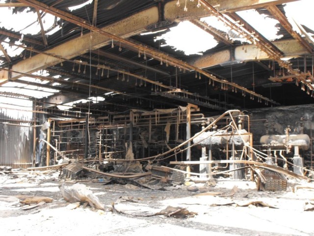 BAGHDAD - This fire-torn building was once used for cold storage at Iraq's top milk factory in Abu Ghraib. The building is under contract to be completely restored to capacity within 90 days according to Tioga, La., native, Sgt. 1st Class Rodney...