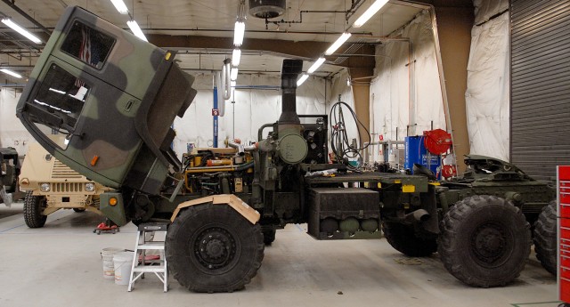 Mechanics repair military tactical vehicles