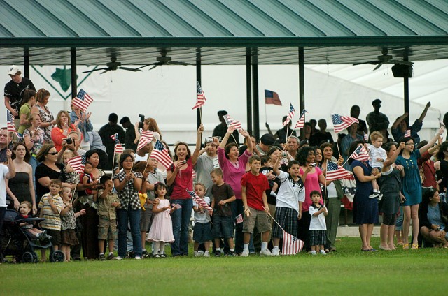 Families, friends and fellow Soldiers celebrate the return of about 200 Soldiers of 4th Infantry Division's Combat Aviation Brigade and a small contingent of Soldiers from the 4th Brigade Combat Team, 1st Cavalry Division's "torch party," as they...