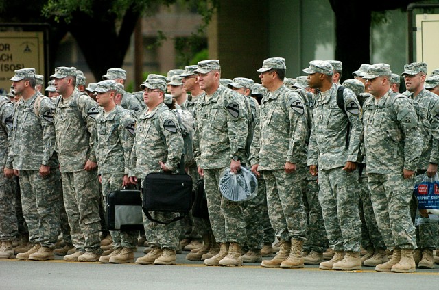Families, friends and fellow Soldiers celebrate the return of about 200 Soldiers of 4th Infantry Division's Combat Aviation Brigade and a small contingent of Soldiers from the 4th Brigade Combat Team, 1st Cavalry Division's "torch party," as they...