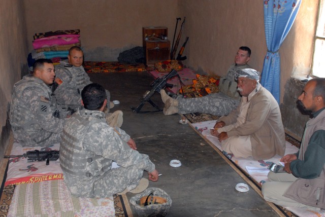 Sgt. 1st Class Miguel Casarez [center left], San Antonio, Texas native, and a platoon sergeant in 4th Squadron, 9th Cavalry Regiment, 2nd Brigade Combat Team, 1st Cavalry Division, meets with Naji Mohammed Ahmed, the Kurdish mukhtar, or village...