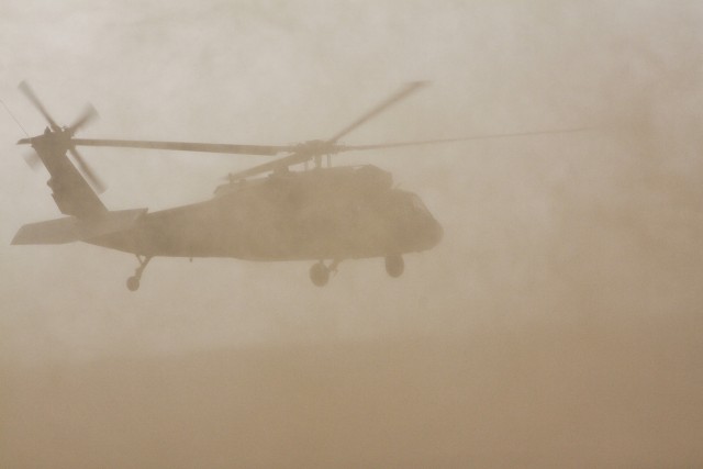 Dust fills the air and creates an almost a no visibility situation as a UH-60 Black Hawk helicopter  from 3rd Assault Helicopter Battalion, 227th Aviation Regiment, 1st Air Cavalry Brigade, 1st Cavalry Division, lifts off during dust landing...