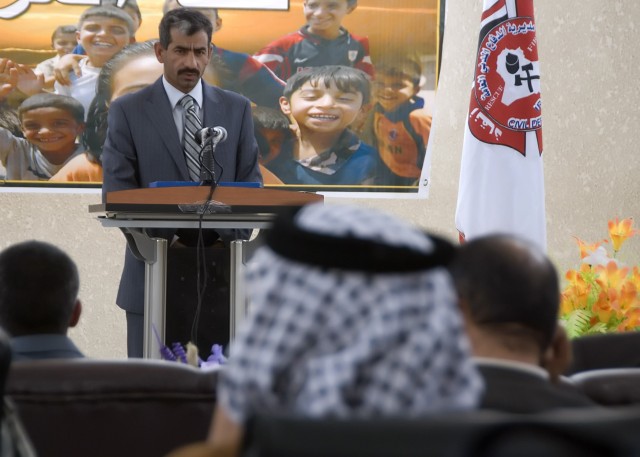 BAGHDAD -  Kamel Abbas, the council chairman of the district of Abu Ghraib, speaks at a ceremony honoring the completion of the Civil Defense Directorate May 7 in Abu Ghraib. The event was a step forward for the community in improving services and...