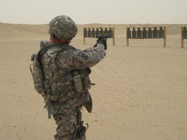 4th BCT, 1AD Soldier fires M9 pistol at range in Kuwait